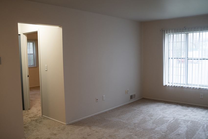 View of living room and hallway 1 bed 1 bath living room