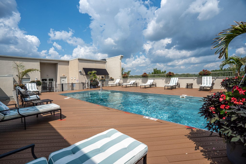 Stripped lounge chairs on the sundeck at the Residences of Creeksides rooftop pool.