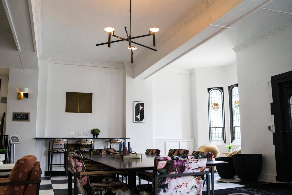 a dining room with a table and chairs and a chandelier