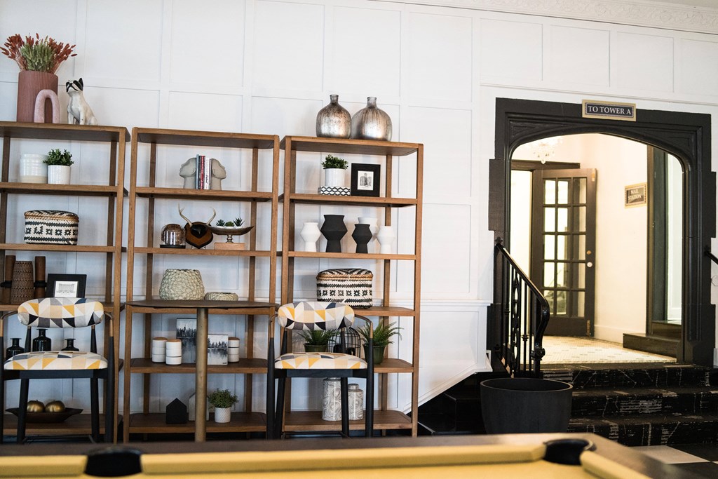 a view of a room with shelves and a pool table