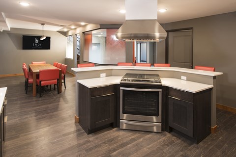 A modern kitchen with a stainless steel oven and island.