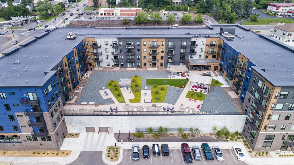 An aerial view of a courtyard surrounded by apartment buildings.