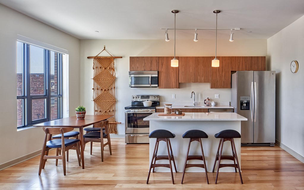 a kitchen and dining area in a 555 waverly unit