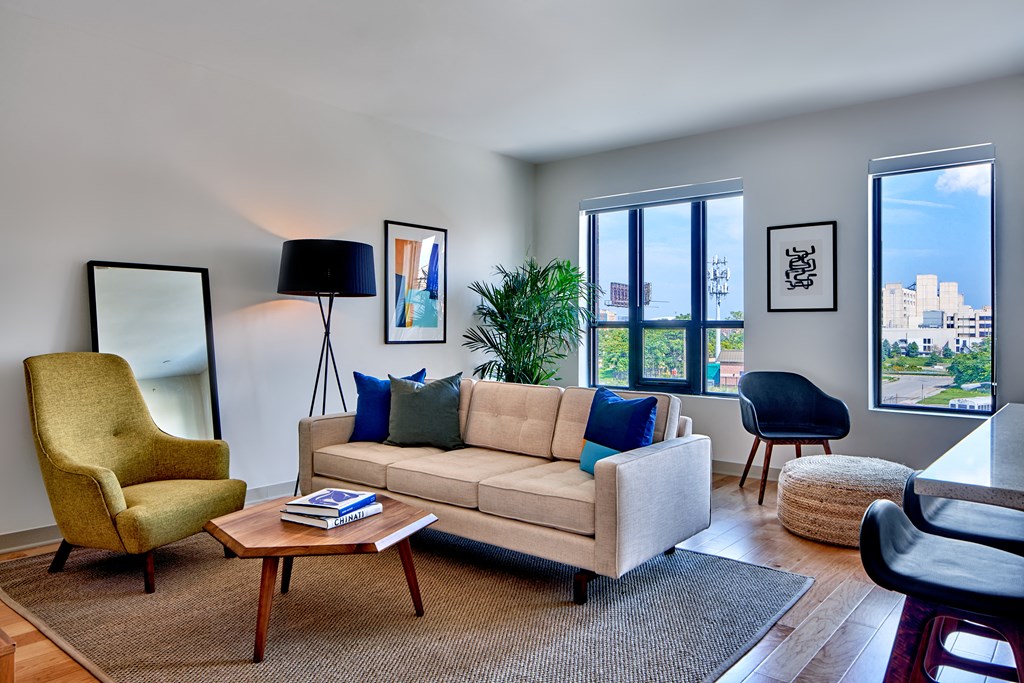a living room with a couch chair and coffee table