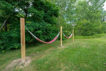 A red rope is tied between two wooden posts.