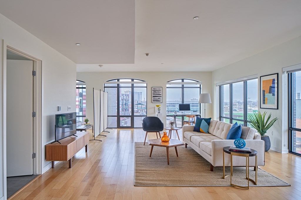 a living room with a white couch and a coffee table