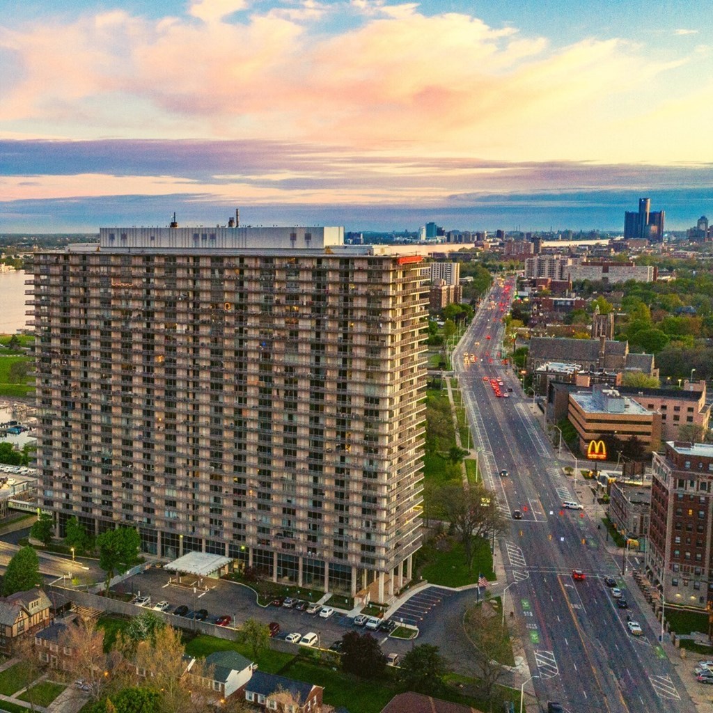 View from The Jefferson. The sun is setting in the background. The view shows Jefferson Ave in Detroit.