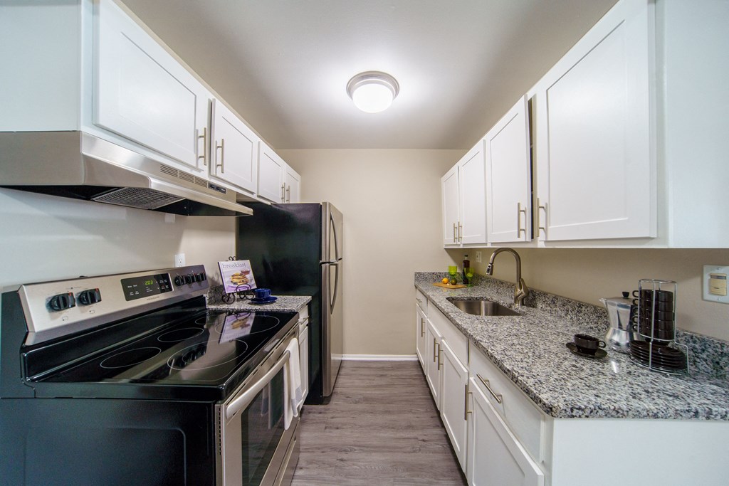 Beautiful Renovated Kitchen Updated white and grey kitchen with stainless steal appliances.