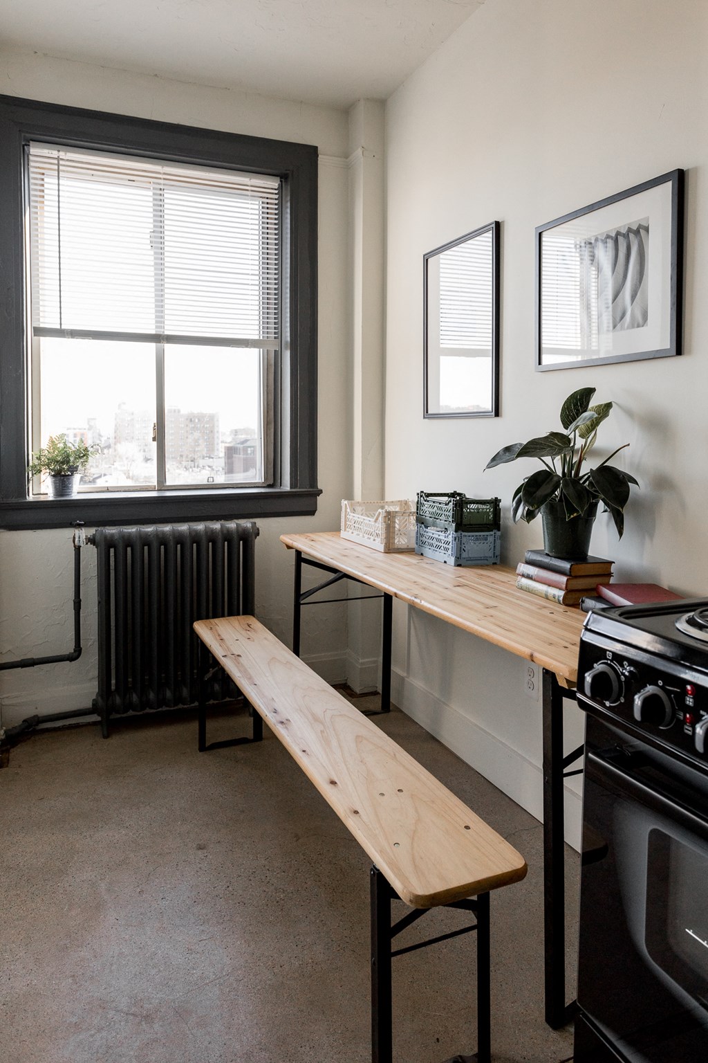 a kitchen with a wooden bench in front of a window