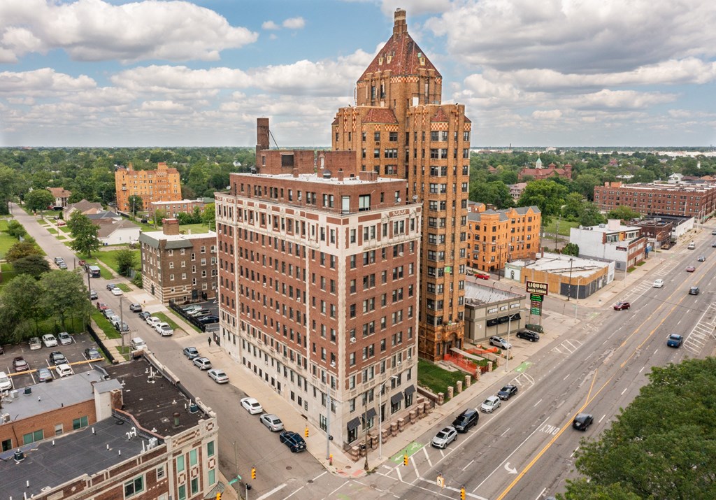 an aerial view of a tall building in a city