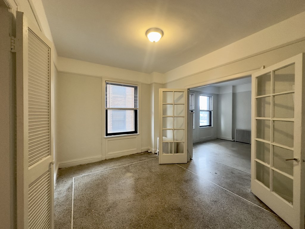 dining area with white walls and ceiling light