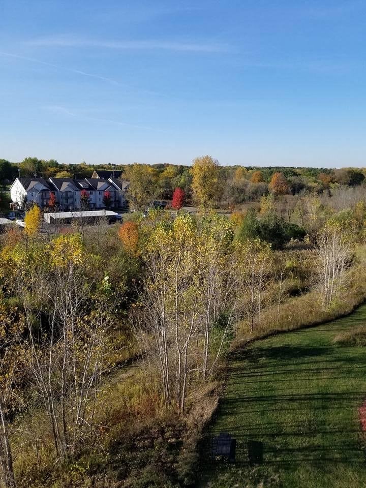 Drone footage of Riverwood landscaping in the fall with colored trees.