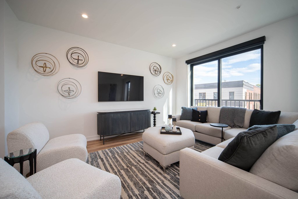 a living room with couches and a tv
