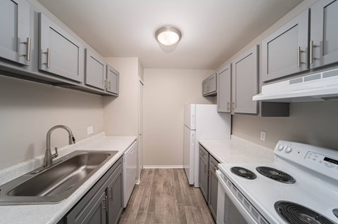 the preserve at ballantyne commons apartment kitchen with white appliances and white cabinets