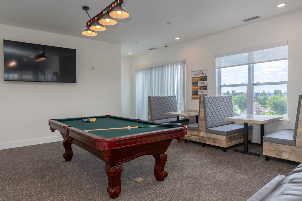 a games room with a pool table and a tv a games room with a pool table and a tv at City View Apartments, Michigan