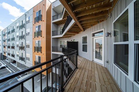 a view of a balcony in a condo building with a wooden roof  at City View Apartments, Lansing, Michigan