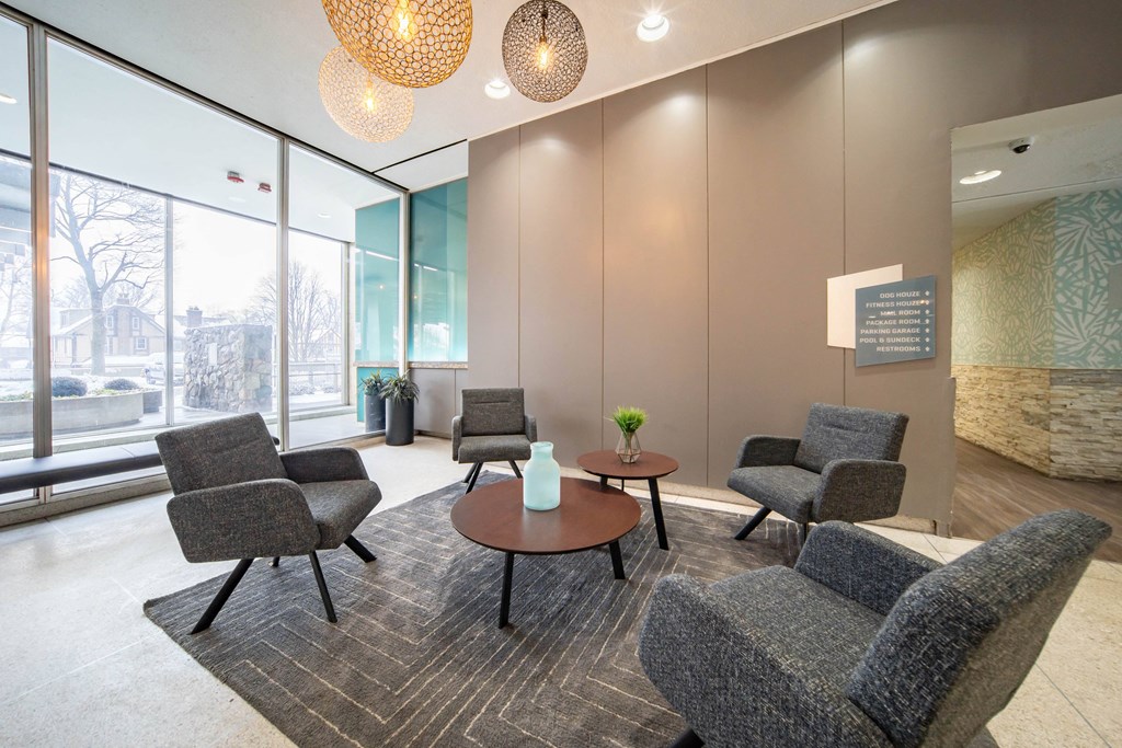 a lounge area with chairs and a table