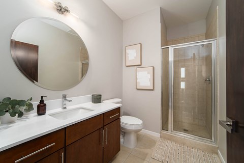 a bathroom with a toilet sink and a shower