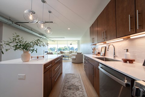 a kitchen and living room in a modern apartment