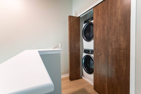 a washer and dryer in a laundry room next to a door