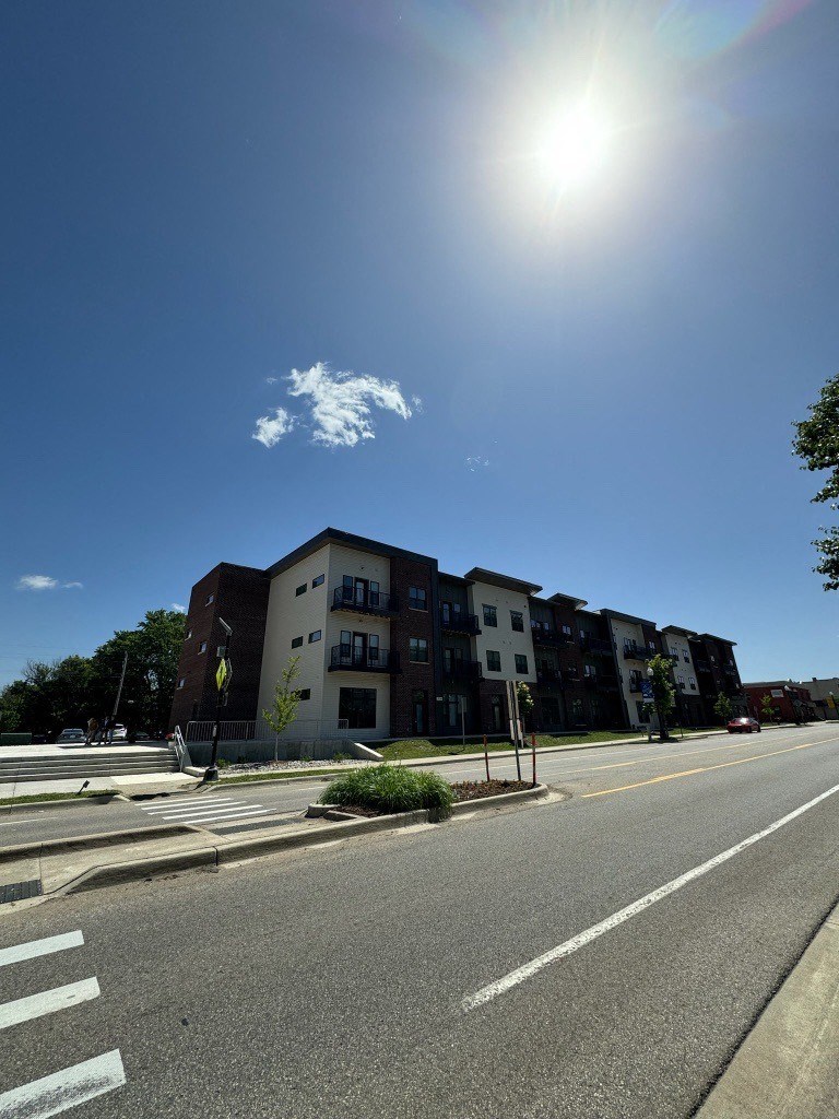 a large building on the corner of a city street