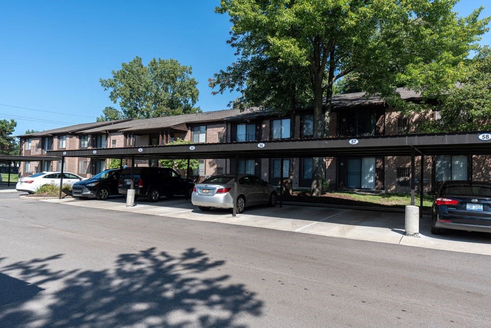 a large building with a parking lot in front of it