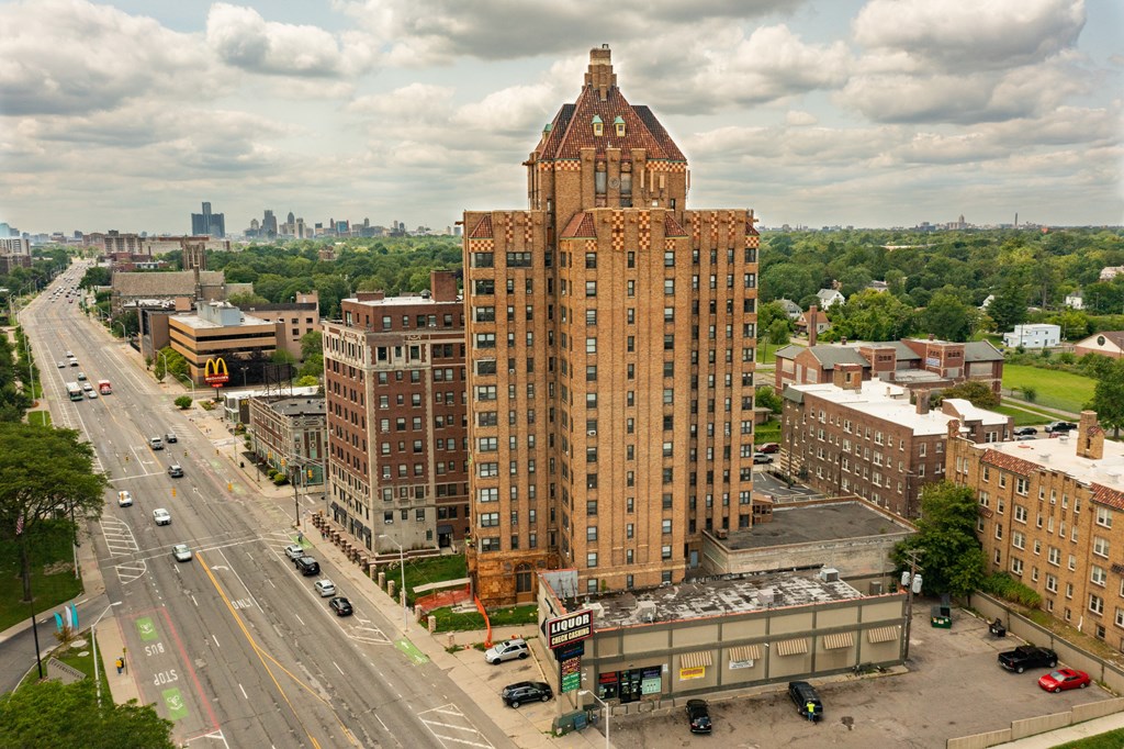 an aerial view of a tall building in a city