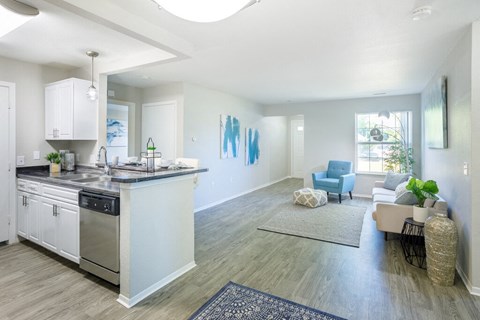 a kitchen and living room with a counter top