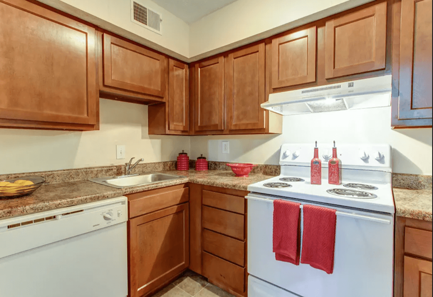 Kitchen with white appliances and laminate cabinets - Photo Gallery