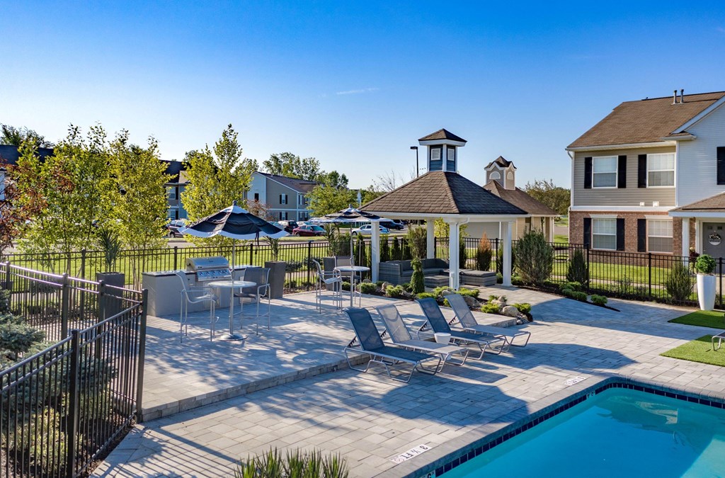 the preserve at ballantyne commons pool and patio area with chairs and a pool