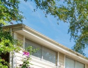 Exterior of buildings with a beautifully landscaped walkway. - Photo Gallery 2