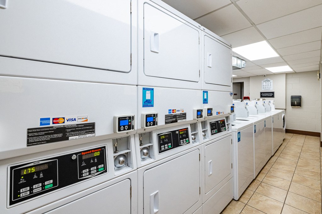 a row of white utility machines in a room