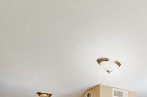 Living room and dining room with tile floor and neutral walls. - Photo Gallery 3