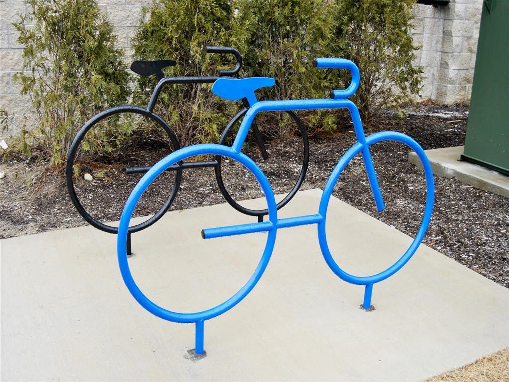a blue bike rack with two bikes on it a blue bike rack with two bikes on it at The George, Michigan, 48104