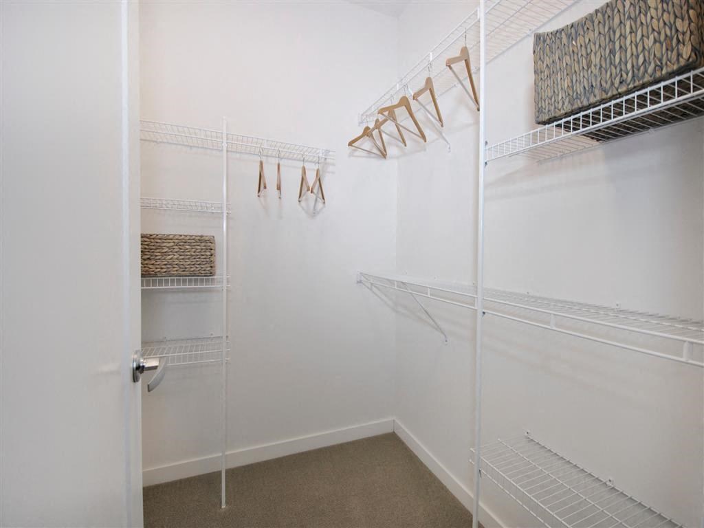 a walk in closet with white walls and a white door a walk in closet with white walls and a white door at The George, Michigan
