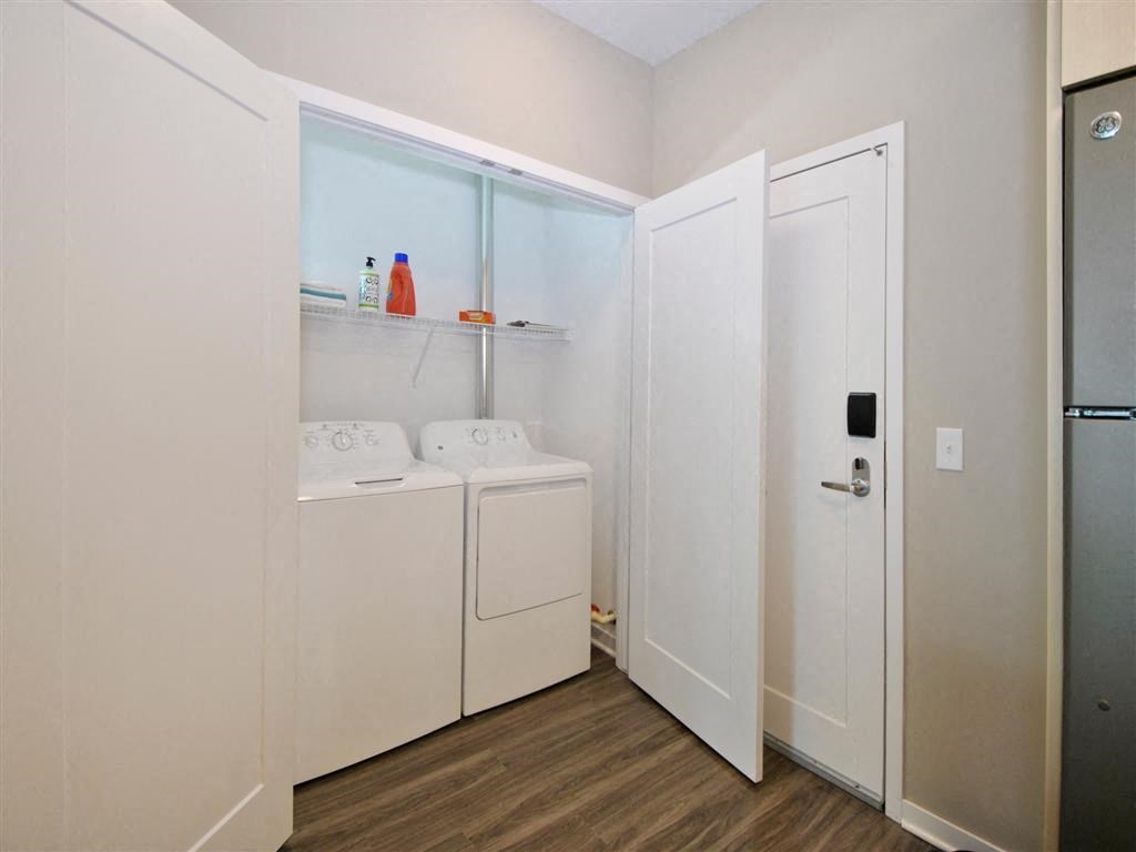 a laundry room with a washer and dryer a laundry room with a washer and dryer at The George, Ann Arbor Michigan