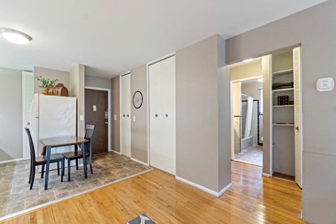 a dining room with a table and a refrigerator