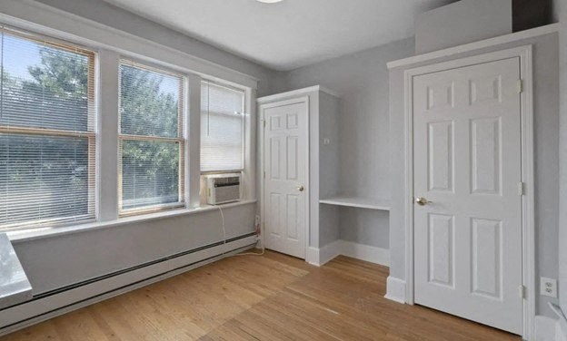 an empty room with a door and a window