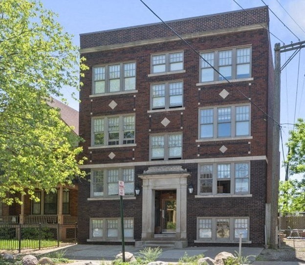 the front of a brick building with a