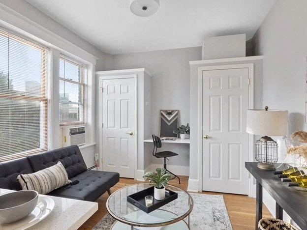 a living room with a couch and a table