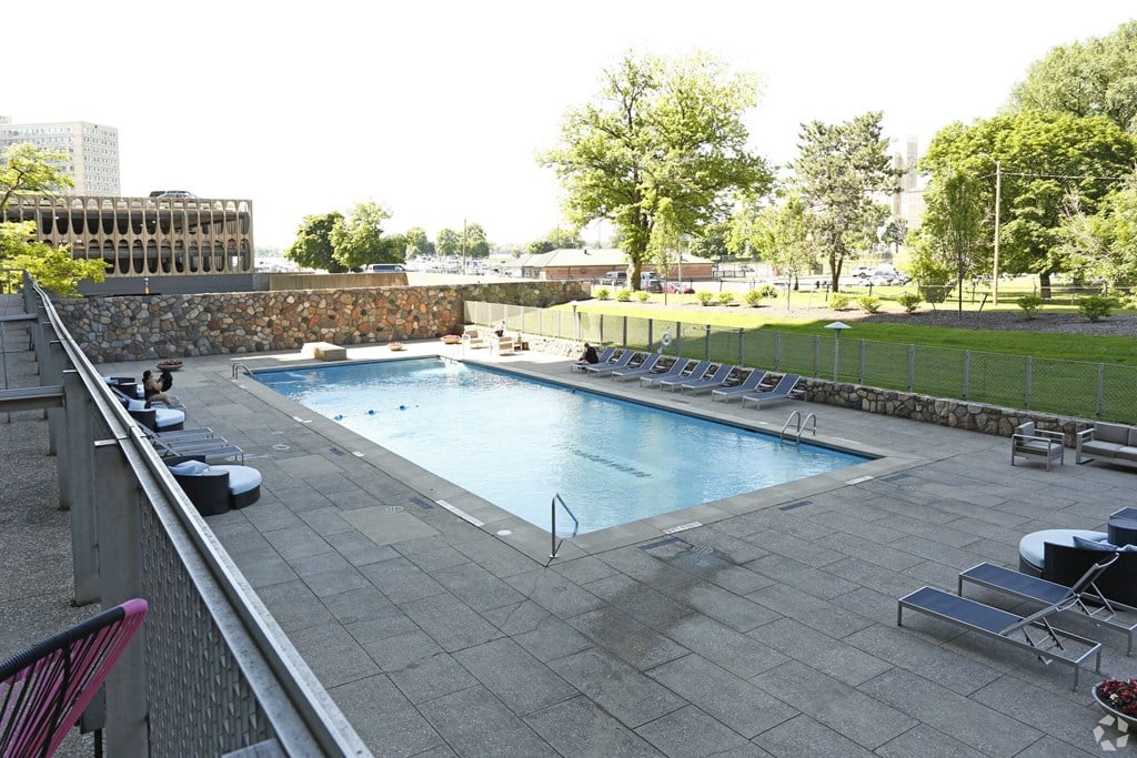 a swimming pool on the roof of a hotel