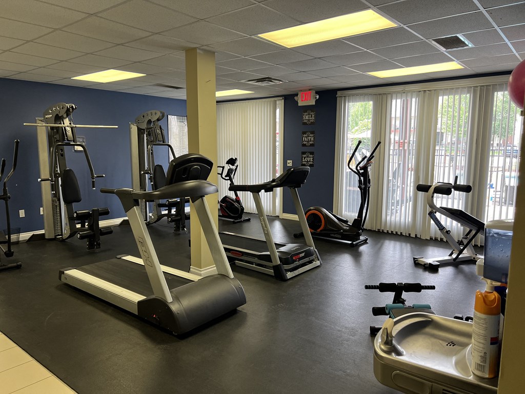 a room filled with lots of different types of exercise equipment