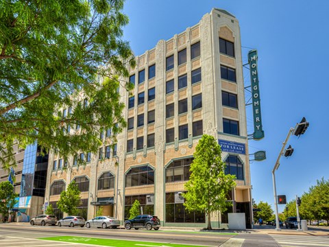 A Montgomery on Leaf building with cars parked in front.