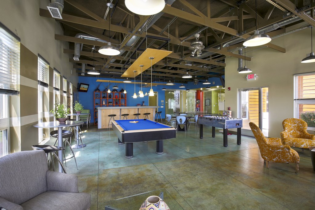 a game room with a pool table and ping pong at Village Club of Rochester Hills, Michigan
