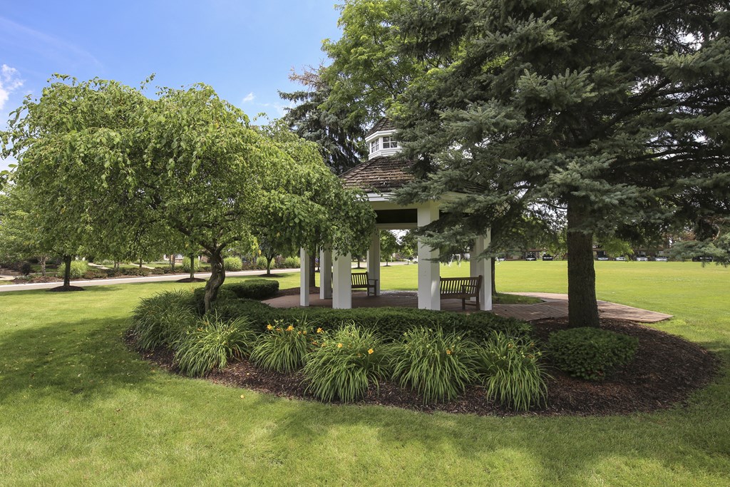 a park with trees and a gazebo at Village Club of Rochester Hills, Shelby Township, 48317