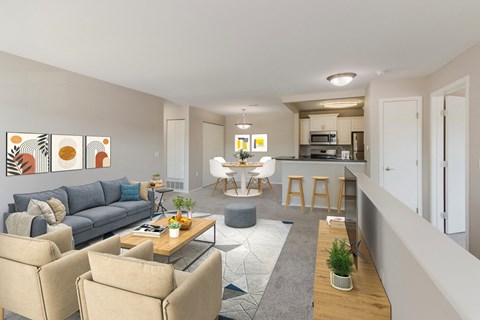 a living room and kitchen with couches and a table
