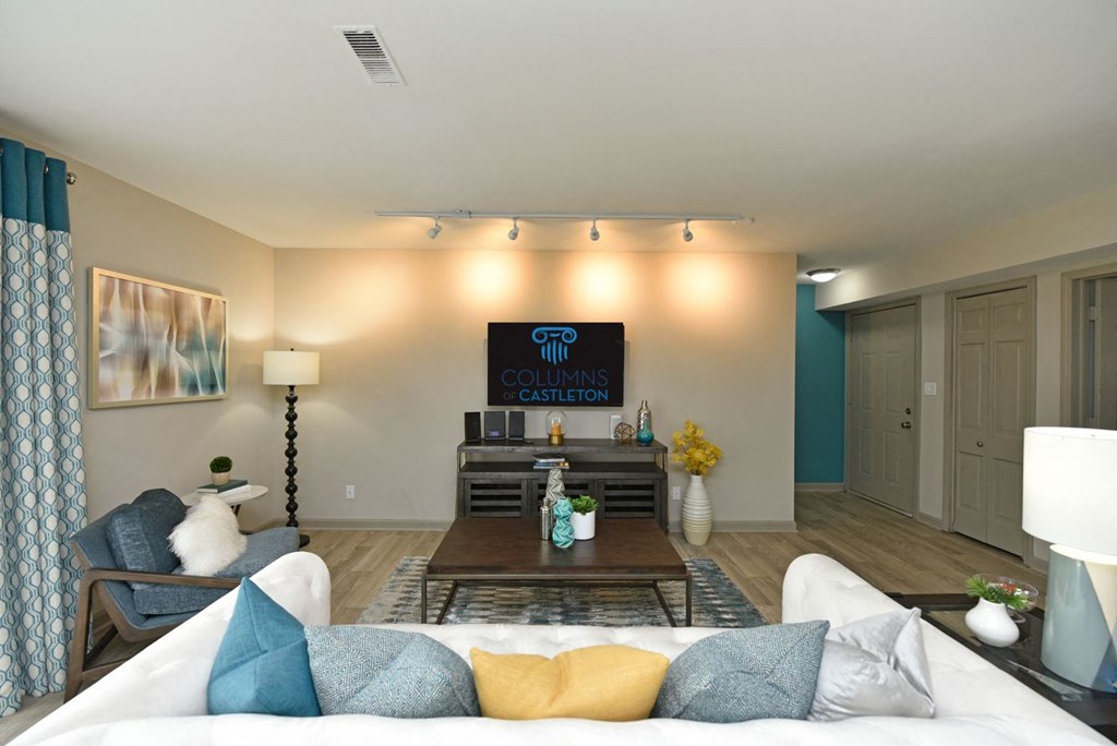 a living room with a couch and a table