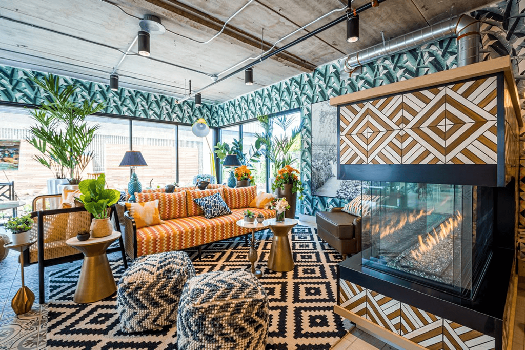 a living room filled with furniture and a fireplace at City Club Apartments Lafayette Park, Detroit, MI 48207