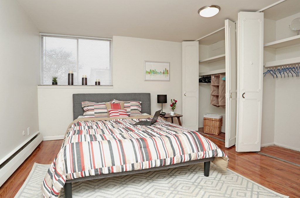 a bedroom with a bed and a closet