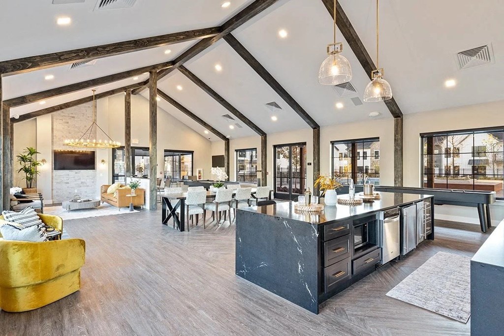 a large living room with a kitchen and a dining room